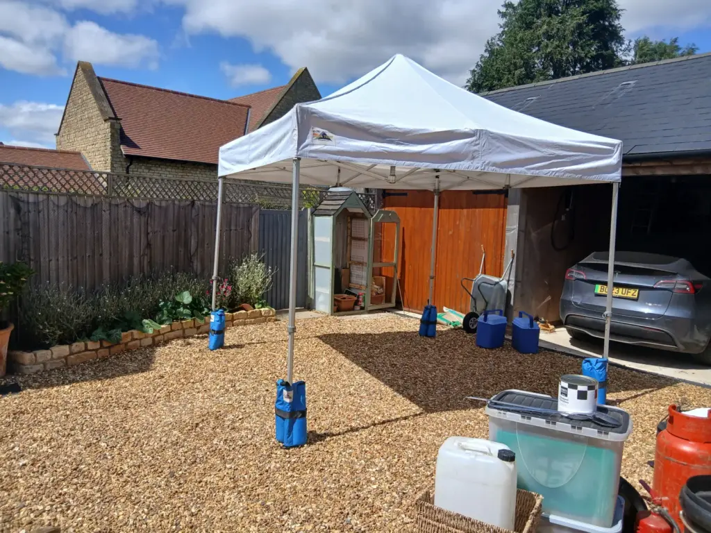 Setting up our white pop up cover for Paella Catering