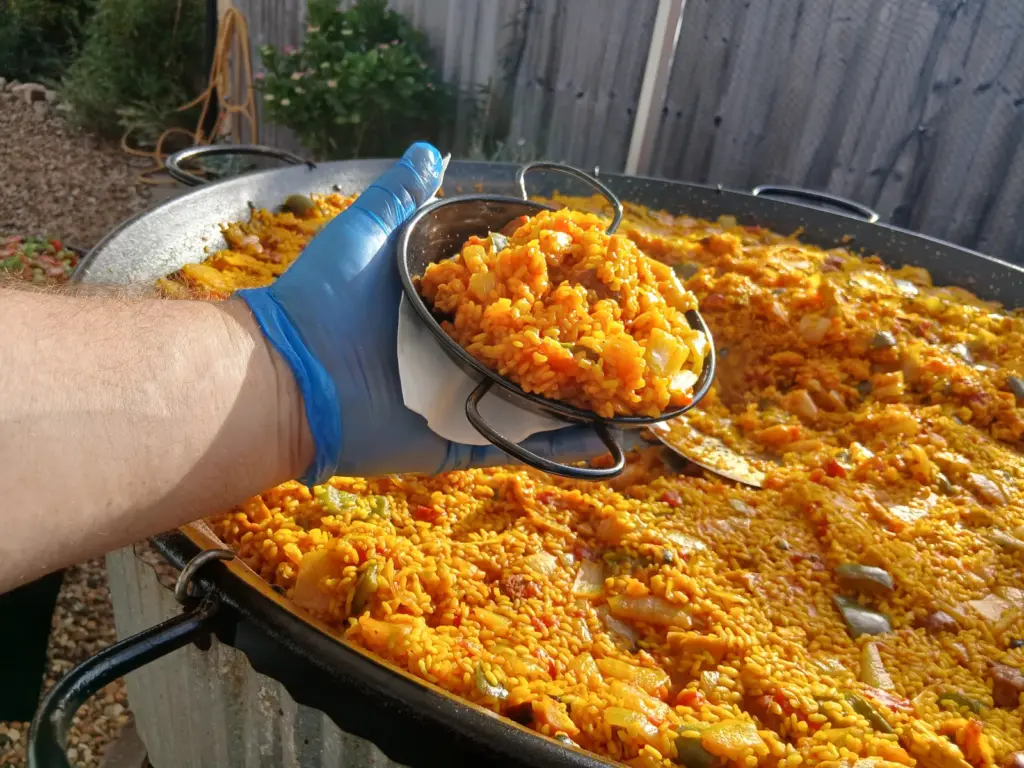 Freshly served birthday party paella catering