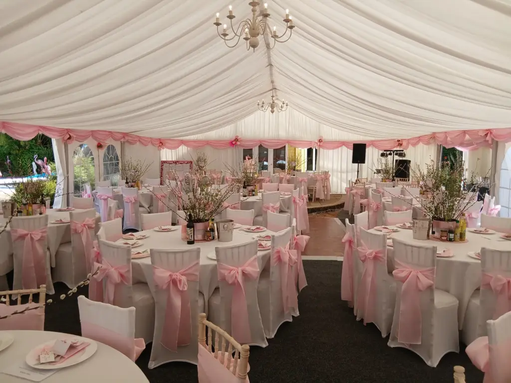 Pink and white marquee prepared for 120 wedding guests