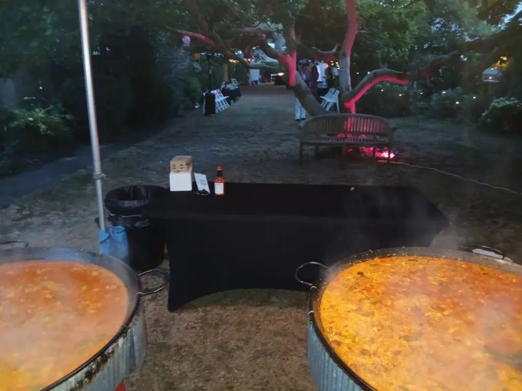 Chicken and chorizo and vegan paellas cooking for 75 guests in London