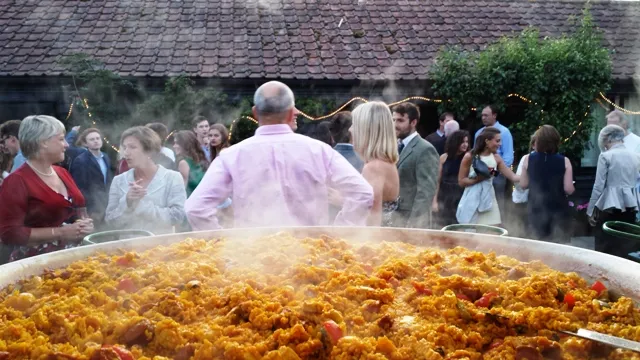 Christmas paella catering with freshly cooked paella served at a party